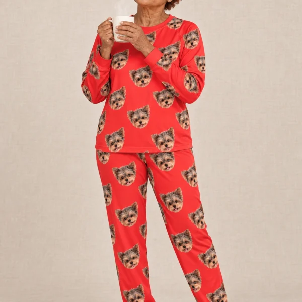 Woman wearing birthday pajamas covered in Yorkshire terrier faces on red fabric — MyDogPics