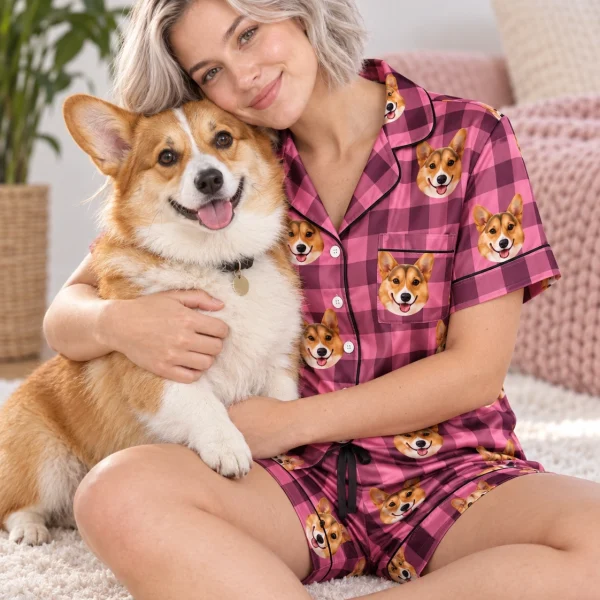 Woman in a blue pajama set cuddling her corgi — MyDogPics