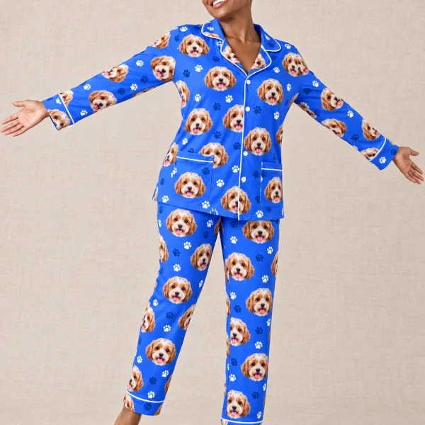 Woman posing in blue pajamas, doodle puppy faces on royal blue paw-print fabric with contrast piping — MyDogPics