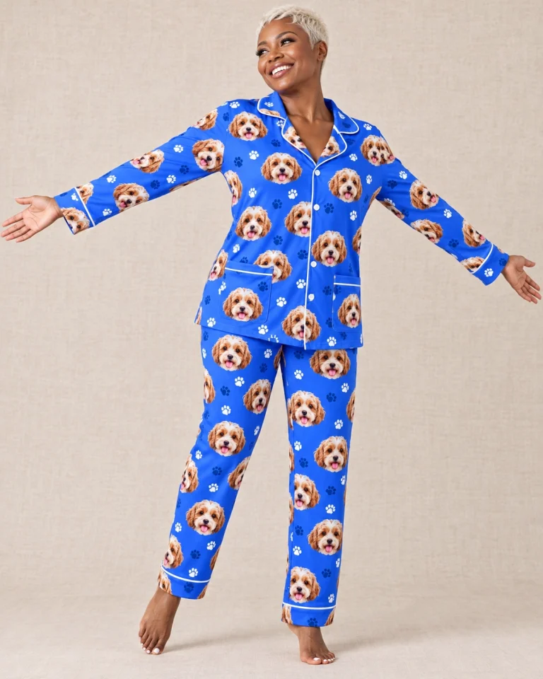 Woman posing in blue pajamas, doodle puppy faces on royal blue paw-print fabric with contrast piping — MyDogPics