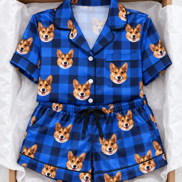 Flat lay of bridal party pajamas: shirt and shorts covered in tan-and-white corgi faces — MyDogPics