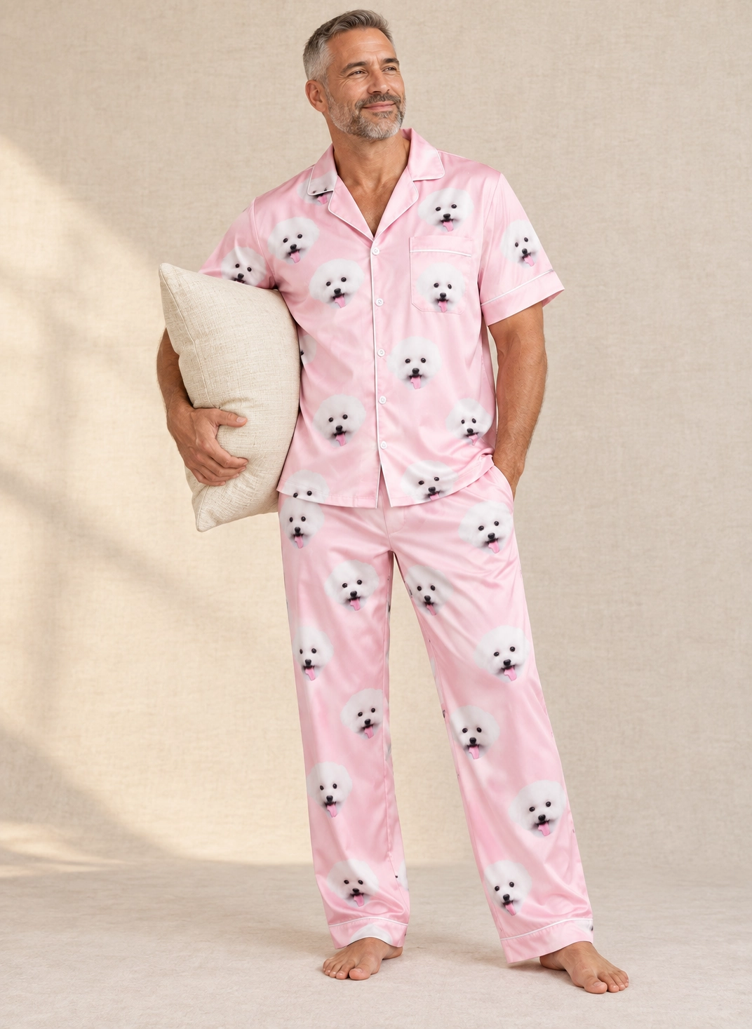 Button Up Pajama Set – Front View, Blush Pink | MyDogPics Man wearing a button up pajama set covered in white Pomeranian faces on blush pink satin — MyDogPics