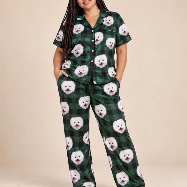 Woman wearing a button up pajama set covered in white Pomeranian faces on green plaid satin — MyDogPics