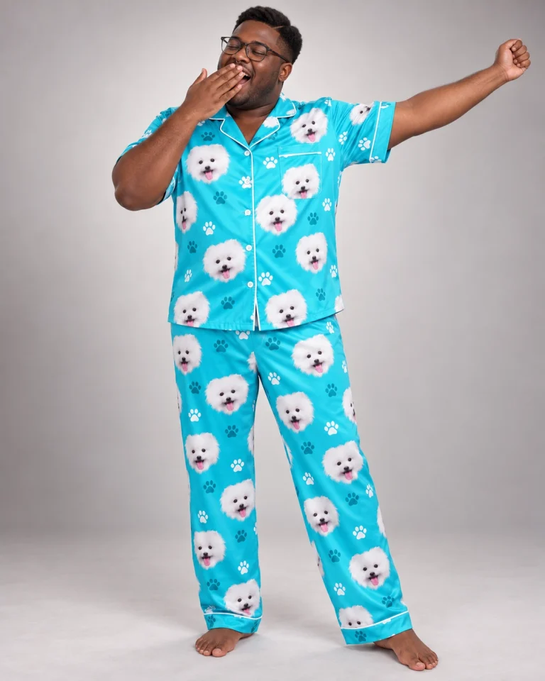 Man posing in a button up pajama set, white Pomeranian faces on teal paw-print satin — MyDogPics