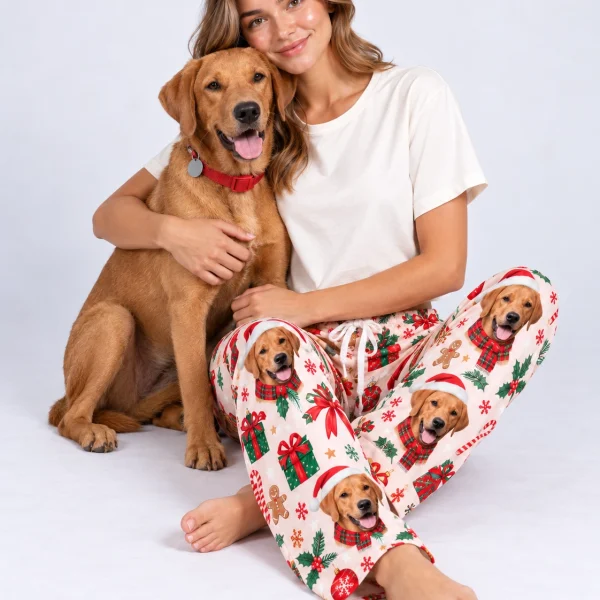 Woman in Christmas pajama pants cuddling her golden retriever — MyDogPics