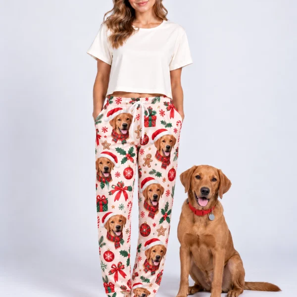 Woman in Christmas pajama pants standing next to her golden retriever — MyDogPics