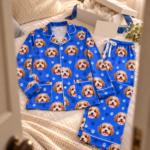 Flat lay of classic pajamas: shirt and pants covered in doodle puppy faces — MyDogPics