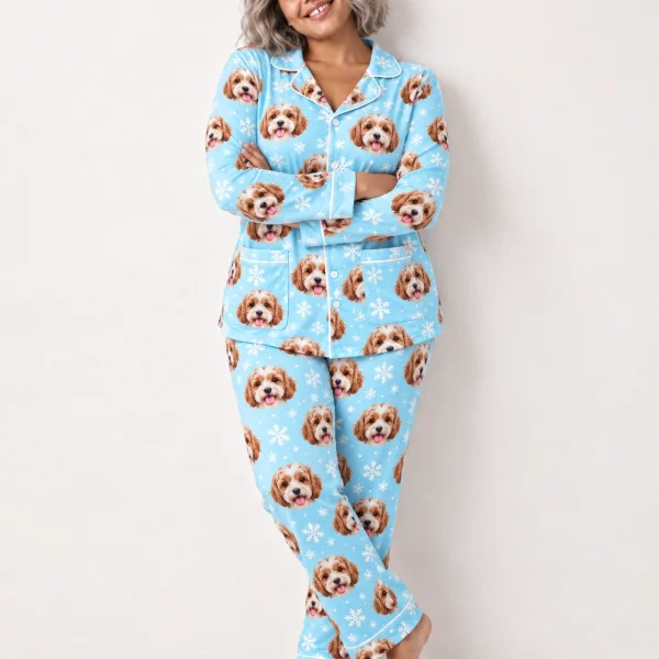 Woman wearing classic pajamas covered in doodle puppy faces on light blue snowflake fabric with contrast piping — MyDogPics