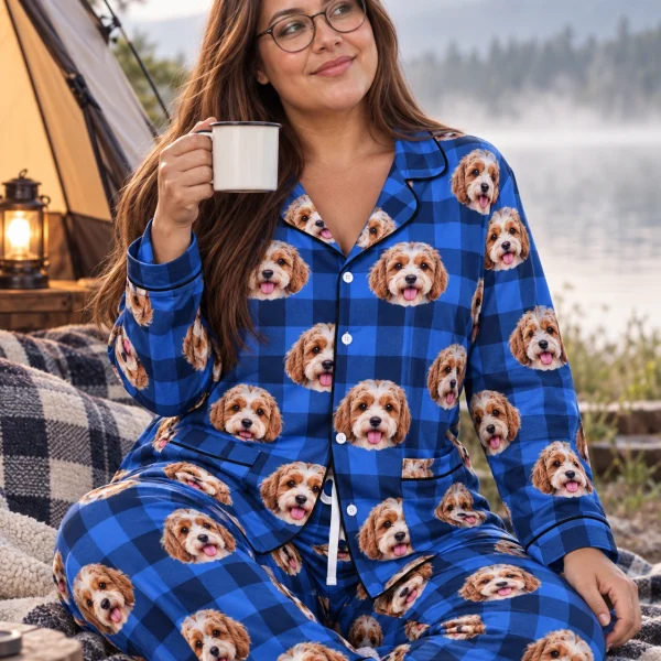 Woman sitting in classic pajamas covered in doodle puppy faces — MyDogPics