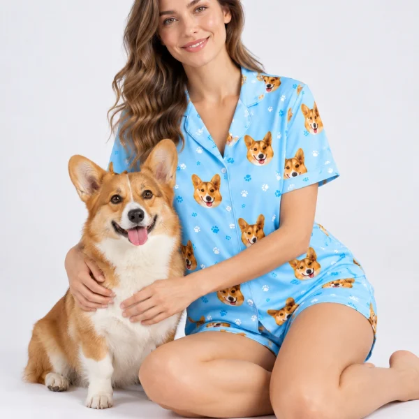 Woman in corgi pajamas cuddling her corgi — MyDogPics