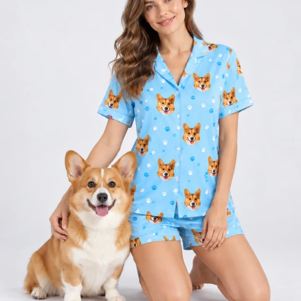 Woman in corgi pajamas cuddling her corgi — MyDogPics