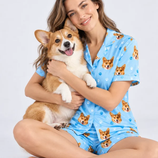 Woman in corgi pajamas holding her corgi — MyDogPics