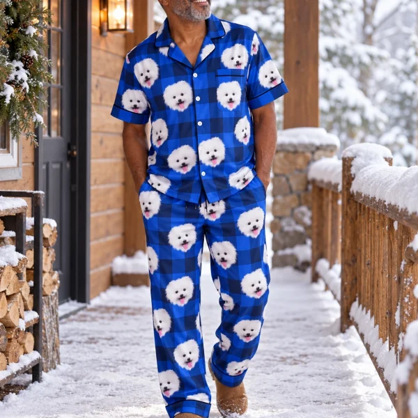 Man wearing couples Christmas pajamas covered in white Pomeranian faces on blue plaid satin — MyDogPics