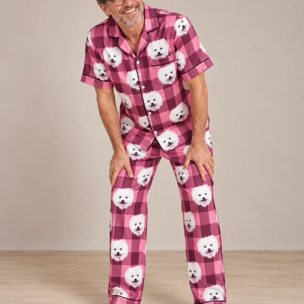 Man posing in couples Christmas pajamas, white Pomeranian faces on pink plaid satin — MyDogPics