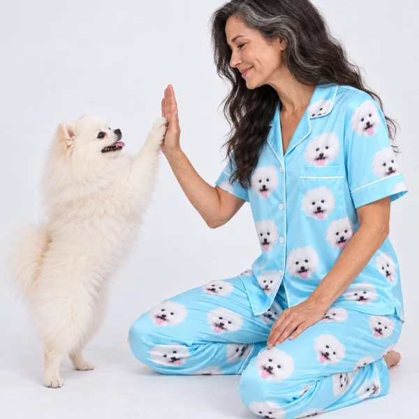 Woman in couples Christmas pajamas with her Pomeranian — MyDogPics