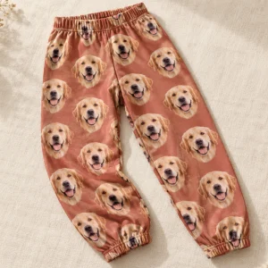 A golden retriever's face printed all over custom kids pajama pants — MyDogPics