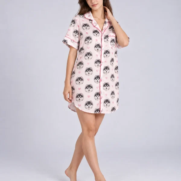 Side view of a custom nightgown with fluffy black-and-white puppy faces on blush pink satin with hearts — MyDogPics