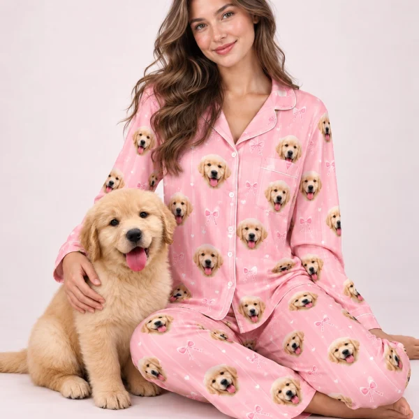 Woman in custom satin pajamas cuddling her golden retriever puppy — MyDogPics