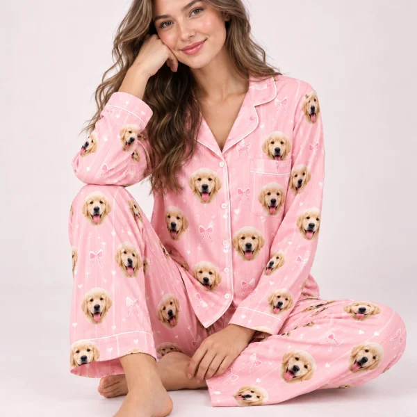 Woman sitting in custom satin pajamas covered in golden retriever puppy faces — MyDogPics