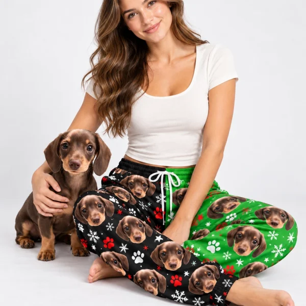 Woman in dachshund pajama pants cuddling her dachshund puppy — MyDogPics