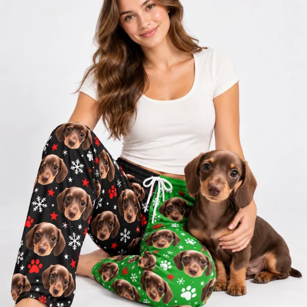 Woman in dachshund pajama pants cuddling her dachshund puppy — MyDogPics