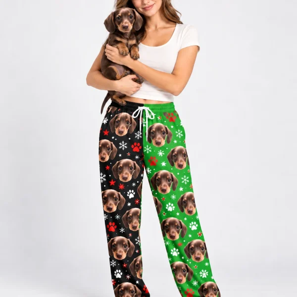 Woman in dachshund pajama pants holding her dachshund puppy — MyDogPics