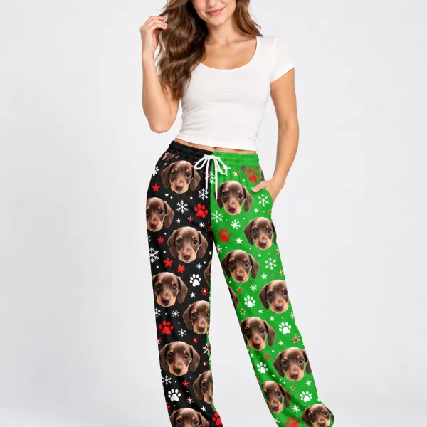 Woman posing in dachshund pajama pants, dachshund faces on a black and green snowflake print — MyDogPics