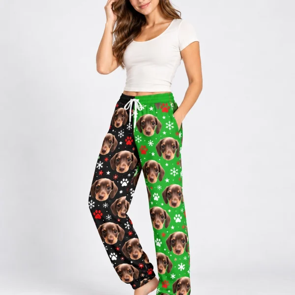 Woman posing in dachshund pajama pants, dachshund faces on a black and green snowflake print — MyDogPics