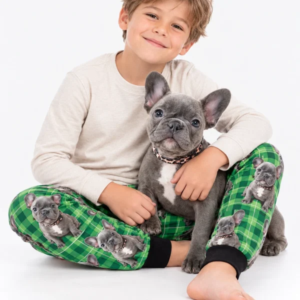 Boy in a dog pajamas for kids cuddling his French bulldog — MyDogPics