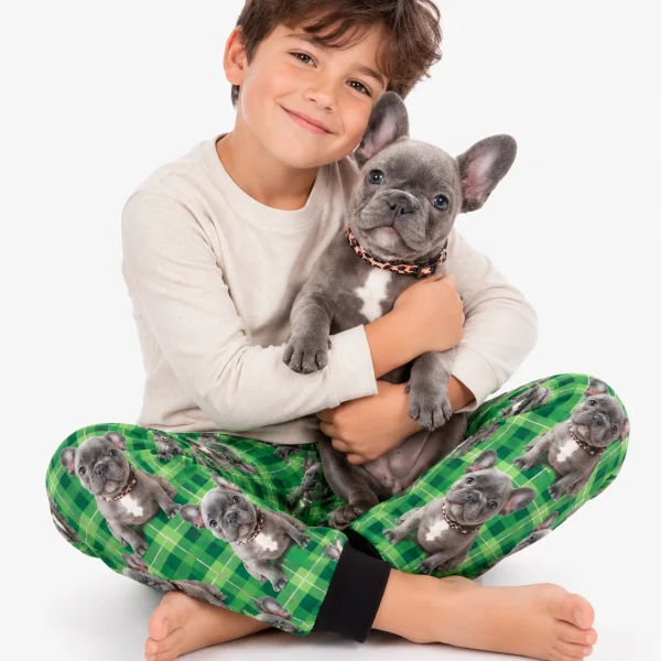 Boy in a dog pajamas for kids cuddling his French bulldog — MyDogPics