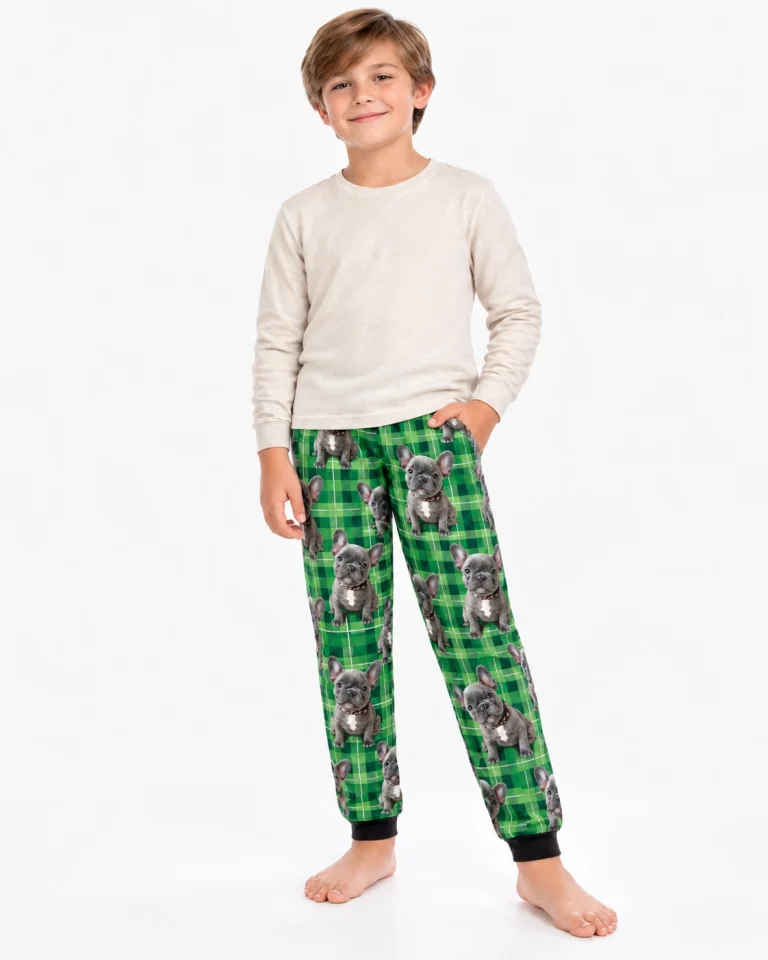 Boy in pajama pants printed with his French bulldog's face, a kids pick for halloween pajamas night