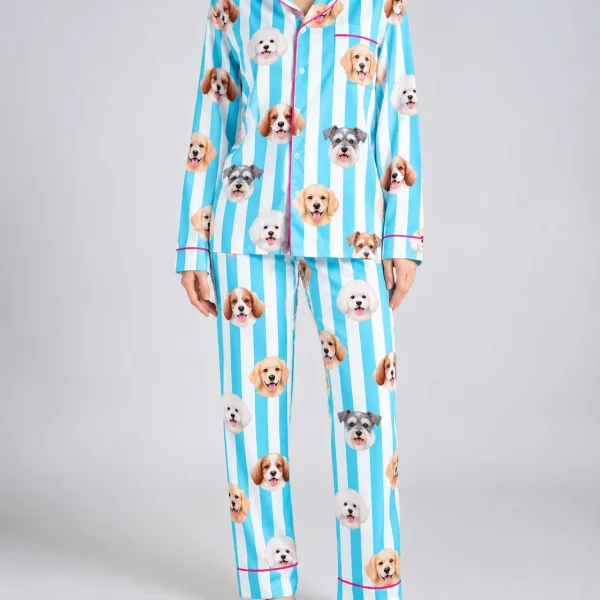 Woman wearing dog print pajamas covered in faces of several different dogs on aqua and white striped satin — MyDogPics