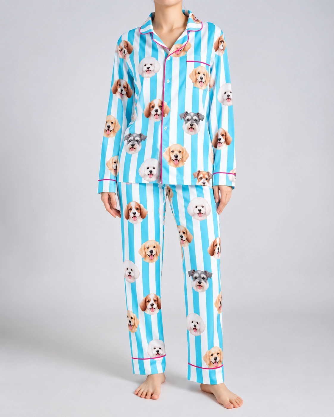 Dog Print Pajamas – Front View | MyDogPics Woman wearing dog print pajamas covered in faces of several different dogs on aqua and white striped satin — MyDogPics