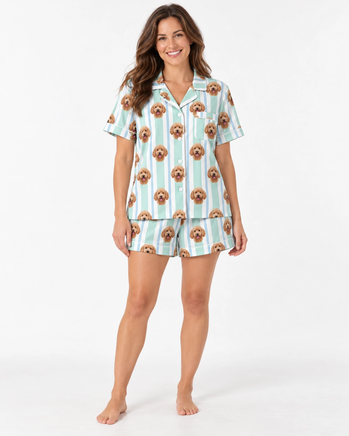 Doodle Pajamas – Front View | MyDogPics Woman wearing doodle pajamas covered in apricot doodle faces on mint and white striped satin — MyDogPics