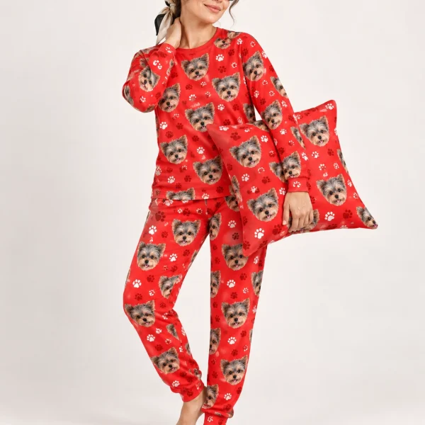 Woman wearing fall pajamas covered in Yorkshire terrier faces on red paw-print fabric — MyDogPics