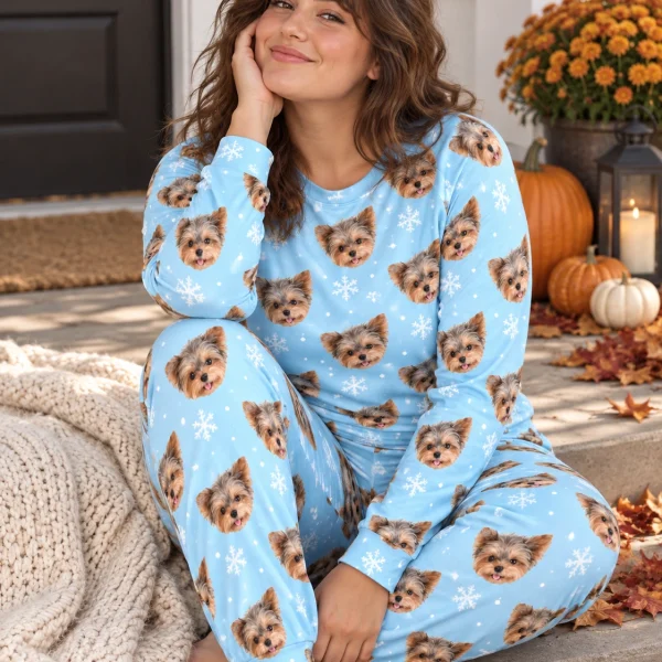 Woman sitting in fall pajamas covered in Yorkshire terrier faces — MyDogPics