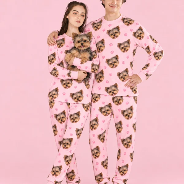 Couple in family matching pajamas holding their Yorkshire terrier — MyDogPics
