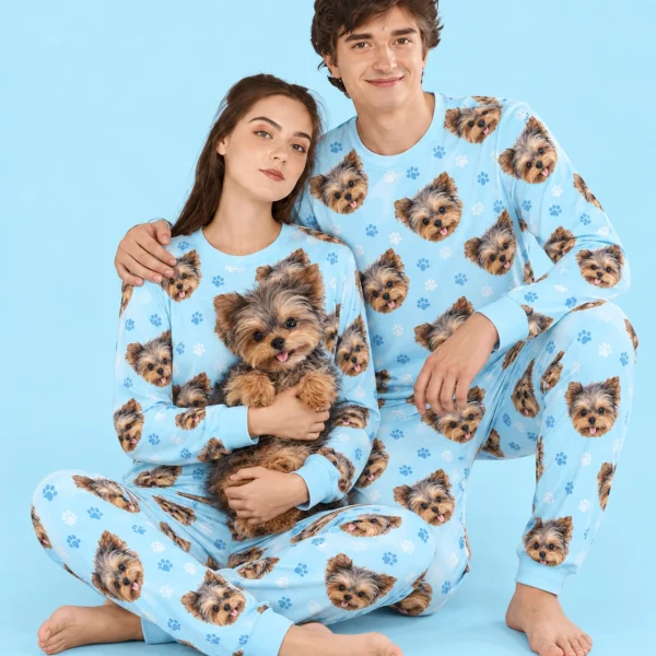 Couple in family matching pajamas holding their Yorkshire terrier — MyDogPics