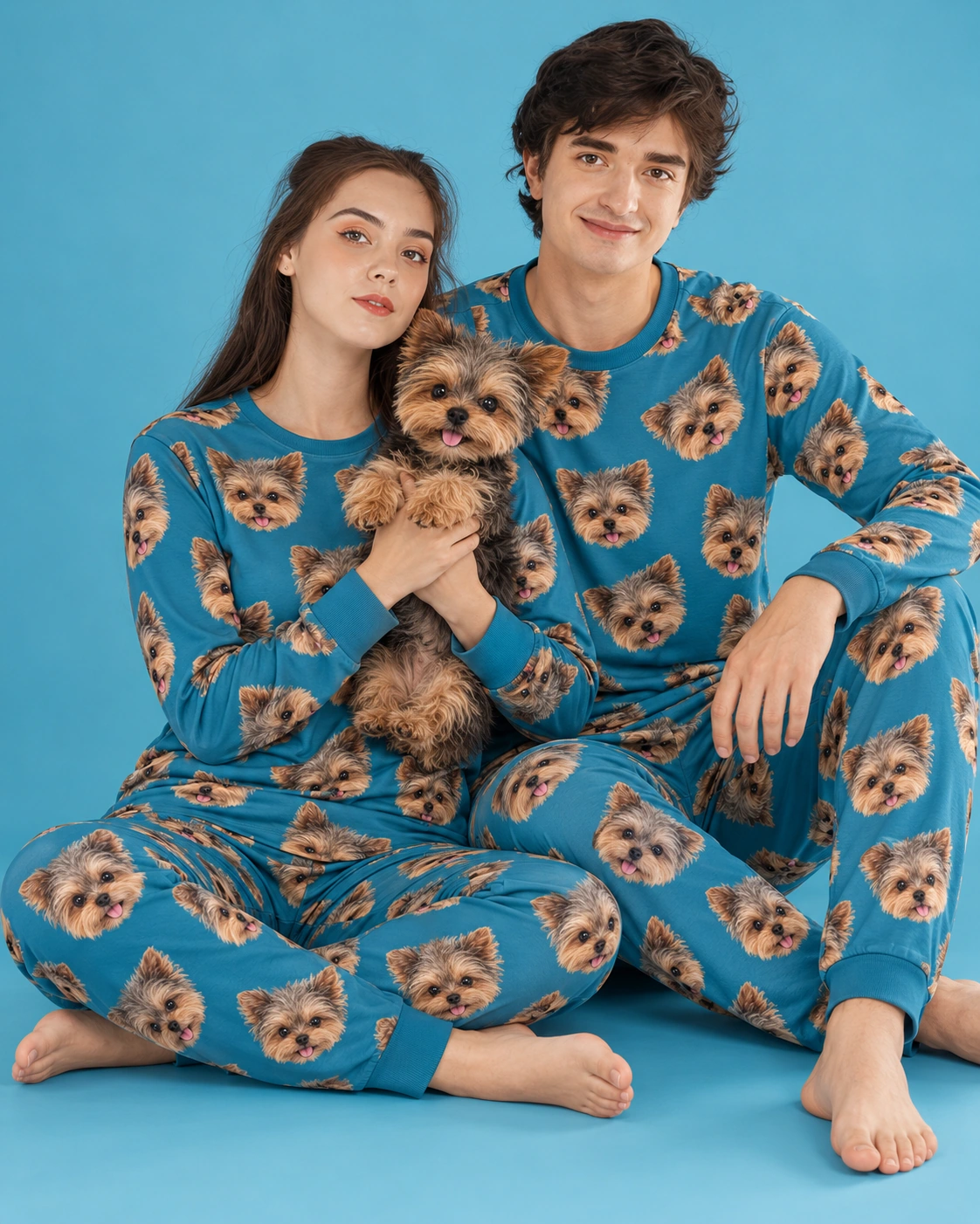 Family Matching Pajamas – Holding Dog, Ocean Blue | MyDogPics Couple in family matching pajamas holding their Yorkshire terrier — MyDogPics
