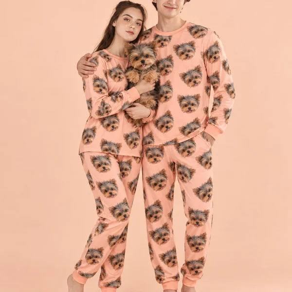 Couple in family matching pajamas holding their Yorkshire terrier — MyDogPics