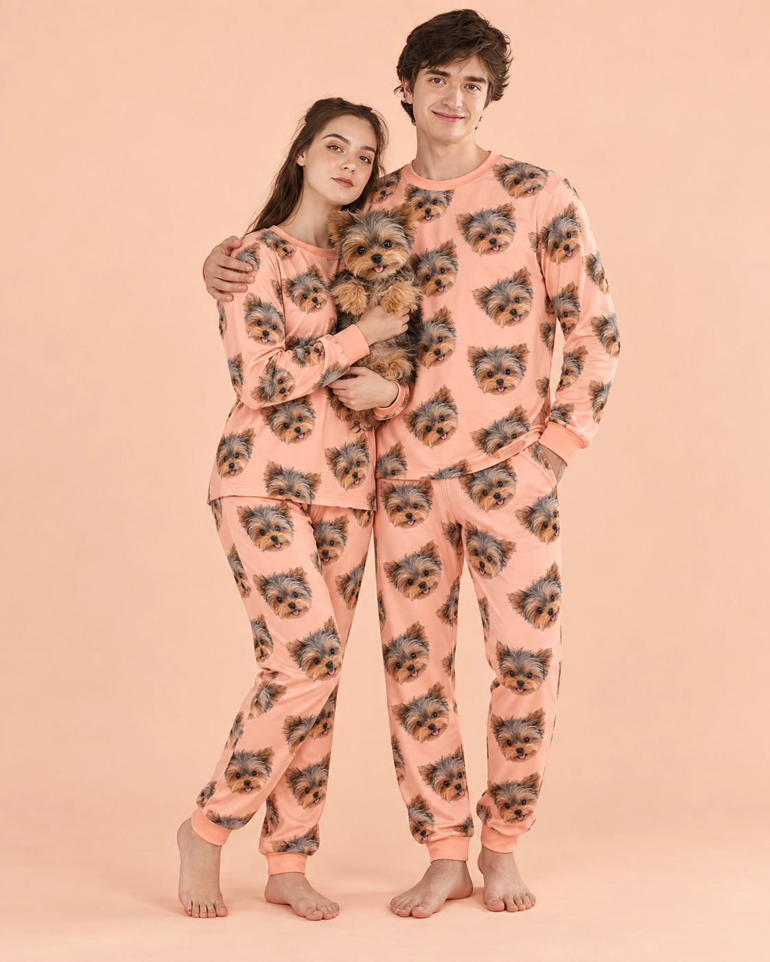 Family Matching Pajamas – Holding Dog, Peach | MyDogPics Couple in family matching pajamas holding their Yorkshire terrier — MyDogPics