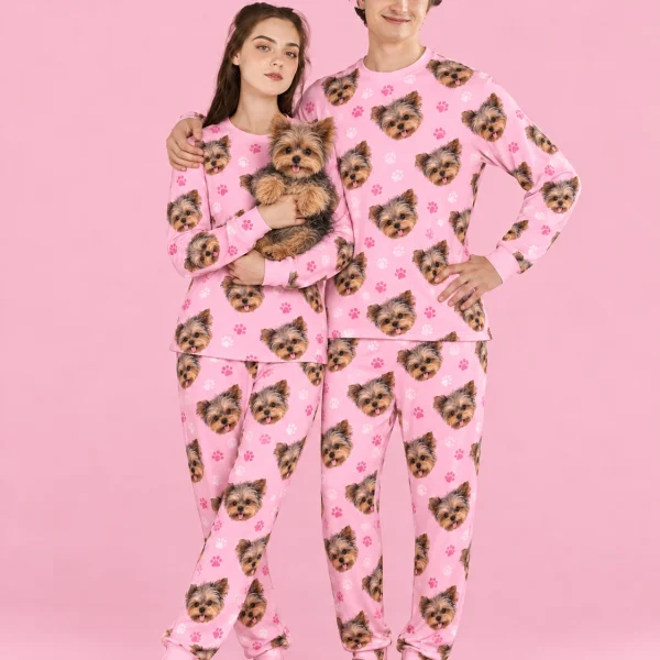 Couple in family matching pajamas holding their Yorkshire terrier — MyDogPics