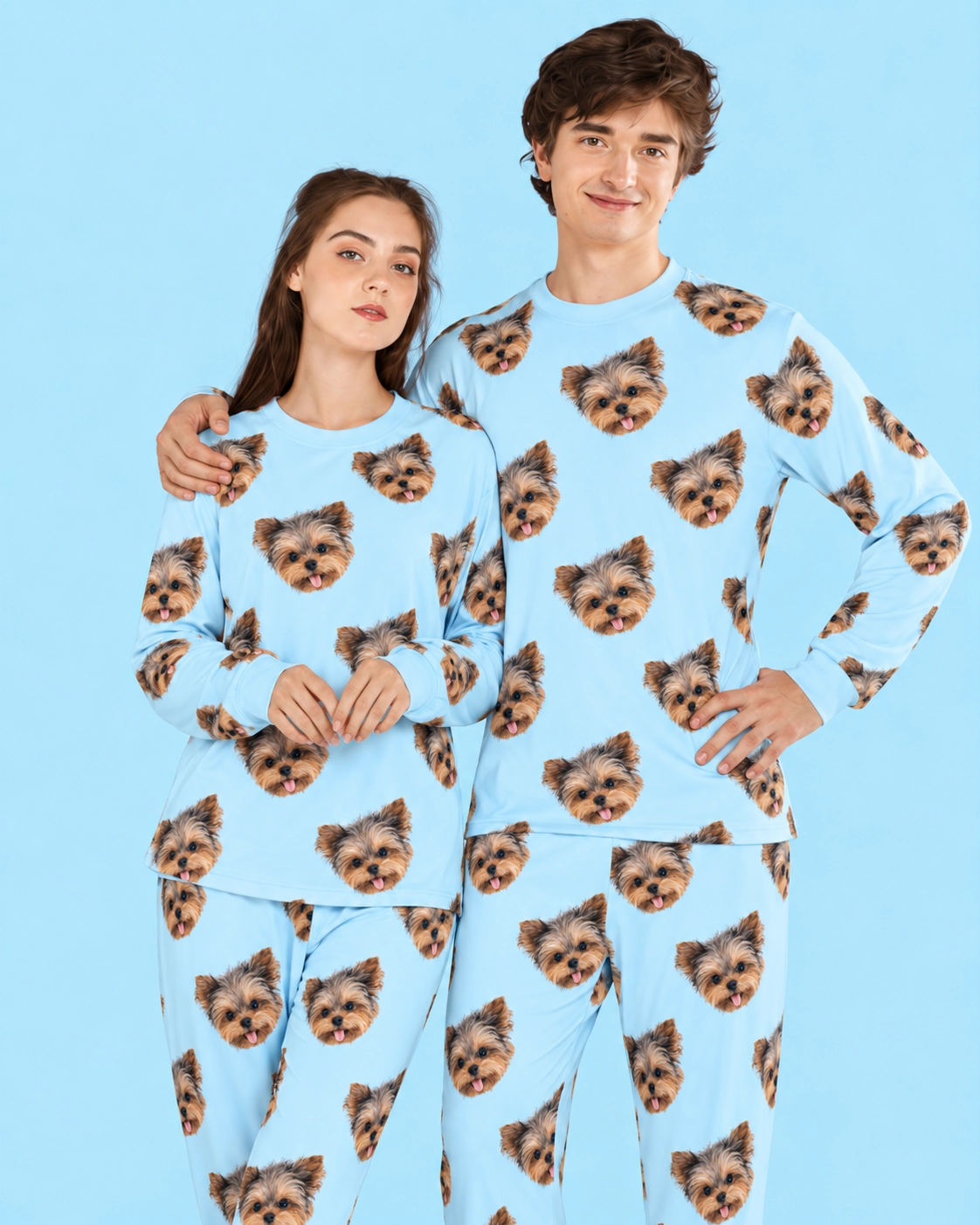 Family Matching Pajamas – Pose, Light Blue | MyDogPics Couple posing in family matching pajamas, Yorkshire terrier faces on light blue fabric — MyDogPics