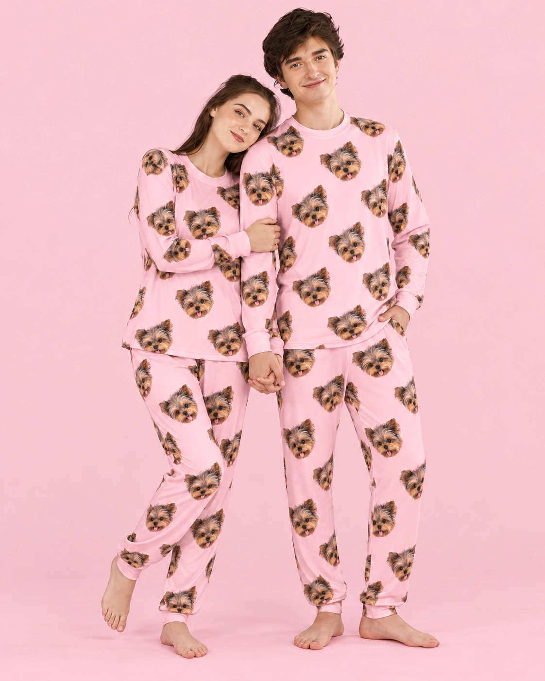 Family Matching Pajamas – Pose, Light Pink | MyDogPics Couple posing in family matching pajamas, Yorkshire terrier faces on light pink fabric — MyDogPics