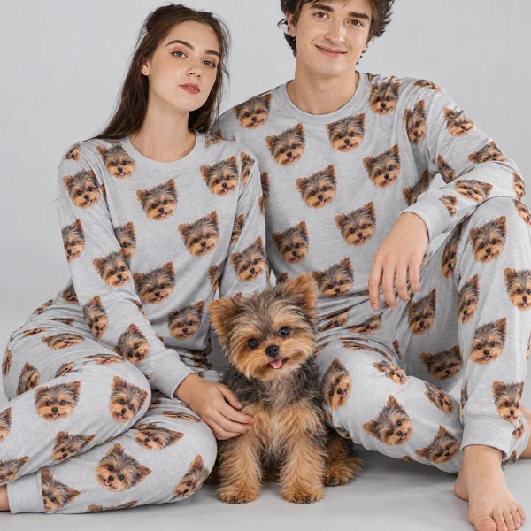 Couple in family matching pajamas with their Yorkshire terrier — MyDogPics