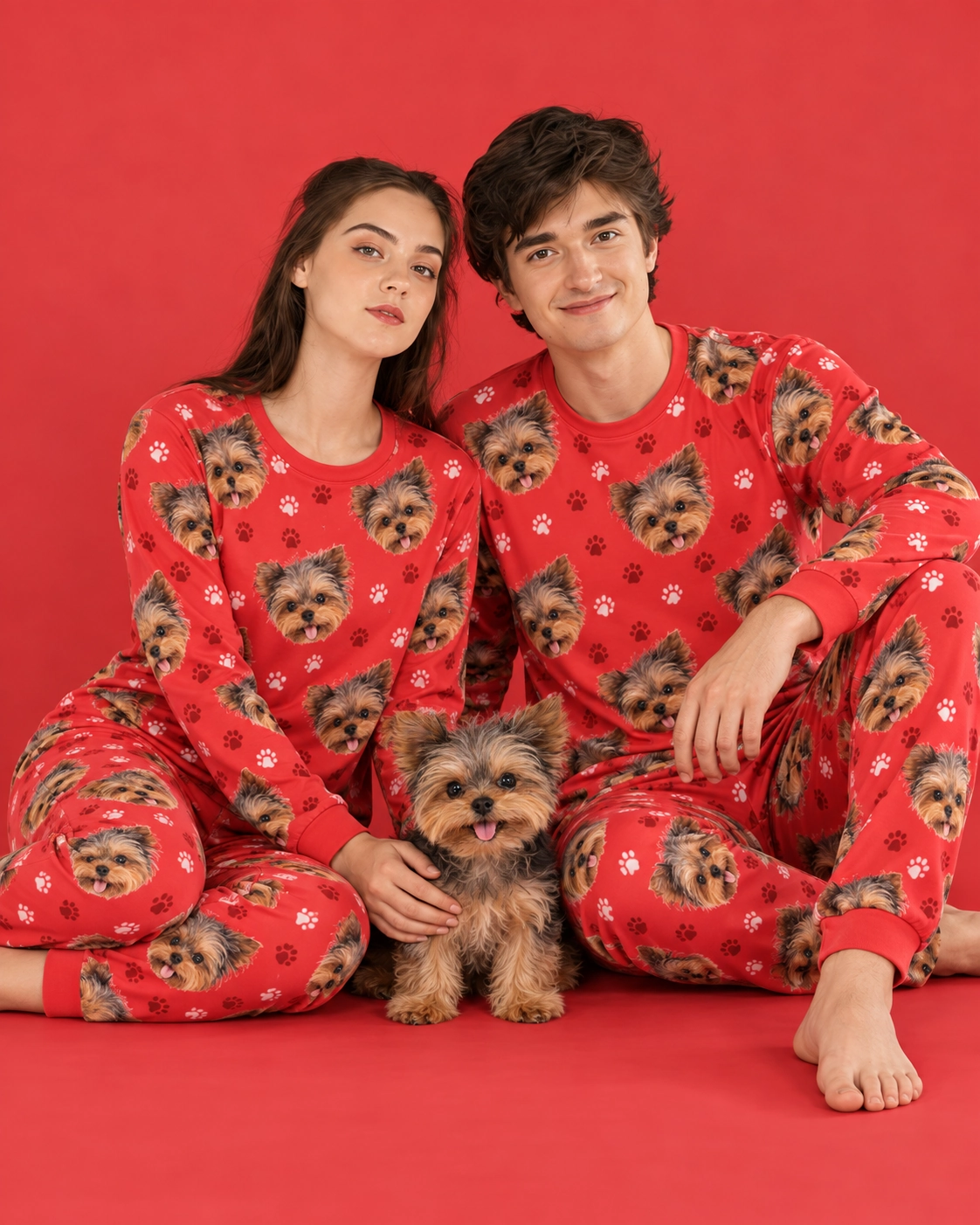 Family Matching Pajamas – With Dog, Red Paw-Print | MyDogPics Couple in family matching pajamas with their Yorkshire terrier — MyDogPics