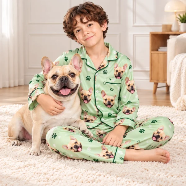 Boy in French bulldog jammies cuddling his French bulldog — MyDogPics