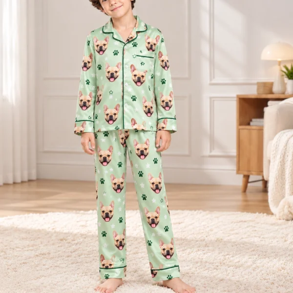 Boy wearing French bulldog jammies covered in fawn French bulldog faces on sage green satin with paw prints — MyDogPics