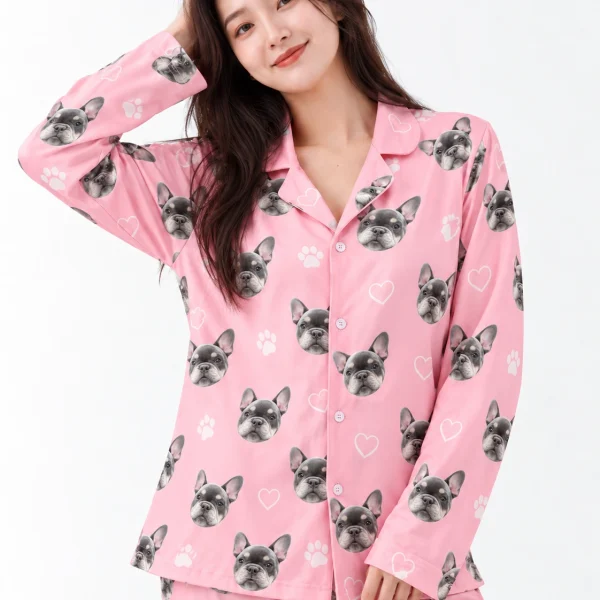 Close-up of the French bulldog pajamas print: grey French bulldog faces on pink with white hearts and paws — MyDogPics