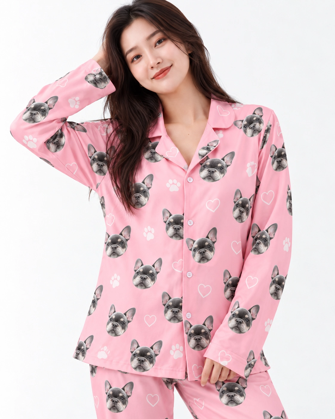 French Bulldog Pajamas – Print Close-Up | MyDogPics Close-up of the French bulldog pajamas print: grey French bulldog faces on pink with white hearts and paws — MyDogPics